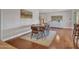 Bright dining room featuring wood table and mid-century modern chairs at 4929 W Christy Dr, Glendale, AZ 85304