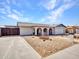 Inviting home exterior with arched entryways, desert landscaping, and convenient driveway at 4929 W Christy Dr, Glendale, AZ 85304