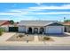 Charming single-story home with desert landscaping, covered porch and attached garage at 4929 W Christy Dr, Glendale, AZ 85304