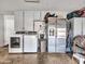 A garage interior featuring a washer, dryer, and stainless steel refrigerator at 4929 W Christy Dr, Glendale, AZ 85304