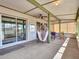 Covered patio featuring a stylish hammock and glass sliding doors for seamless indoor-outdoor living at 4929 W Christy Dr, Glendale, AZ 85304