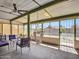 Inviting screened patio with a hammock, seating and fan creating a cozy outdoor living space at 4929 W Christy Dr, Glendale, AZ 85304