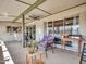 Relaxing covered patio featuring comfortable seating and a ceiling fan for comfortable outdoor lounging at 4929 W Christy Dr, Glendale, AZ 85304