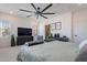 Well-lit main bedroom featuring plush carpet, ample storage, and neutral decor at 5038 W Cheryl Dr, Glendale, AZ 85302