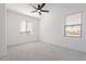 Bright bedroom with neutral carpet, white walls, and natural light, creating a peaceful ambiance at 5038 W Cheryl Dr, Glendale, AZ 85302