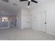 Spacious bedroom featuring neutral walls, carpet, a modern fan, and ample natural light at 5038 W Cheryl Dr, Glendale, AZ 85302