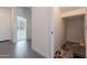 Entry hallway showcasing tiled flooring, storage, and access to other areas of the home at 5038 W Cheryl Dr, Glendale, AZ 85302