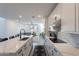 Open kitchen with white cabinetry, stainless steel appliances, and a view into the inviting living area at 5038 W Cheryl Dr, Glendale, AZ 85302