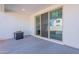 Covered patio with concrete floor, large sliding glass doors to the interior, and shade at 5038 W Cheryl Dr, Glendale, AZ 85302