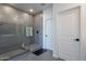 Modern bathroom showcasing a large walk-in shower with gray tile and a glass enclosure at 5038 W Cheryl Dr, Glendale, AZ 85302