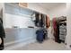 Bright walk-in closet with shelving, hanging rods, and carpet flooring, perfect for organizing wardrobes at 5038 W Cheryl Dr, Glendale, AZ 85302