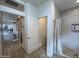 Bathroom view features wood floors, a barn door closet, and a shower room with a view to dining at 5205 N 8Th Pl, Phoenix, AZ 85014