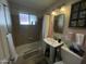 Modest bathroom featuring a shower-tub combo and pedestal sink at 5205 N 8Th Pl, Phoenix, AZ 85014