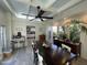 Well-lit dining area with a coffered ceiling, hardwood floors, and easy access to the kitchen and outdoor spaces at 5205 N 8Th Pl, Phoenix, AZ 85014