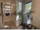 Bright hallway with wood floors leads to bathroom with a door to outdoor patio with a view at 5205 N 8Th Pl, Phoenix, AZ 85014