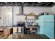 Open kitchen featuring stainless appliances and rustic wood shelving at 5205 N 8Th Pl, Phoenix, AZ 85014