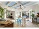 Sunlit living room with modern decor and smooth transition to an outdoor patio for dining and entertaining at 5205 N 8Th Pl, Phoenix, AZ 85014