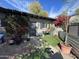 Charming patio area adorned with vibrant plants, colorful pots, and a decorative privacy screen at 5205 N 8Th Pl, Phoenix, AZ 85014