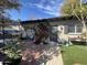 Cozy patio features a brick floor, vibrant flowers, and a seating area for outdoor relaxation at 5205 N 8Th Pl, Phoenix, AZ 85014