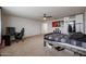 Spacious carpeted bedroom with ceiling fan, gaming station, and cool posters on the wall at 523 S 201St Ave, Buckeye, AZ 85326