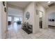 Hallway view that opens to the kitchen and living area, complete with stylish decor and neutral tones at 523 S 201St Ave, Buckeye, AZ 85326