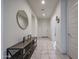 Bright entryway featuring tiled floors, neutral walls, and an attractive console table with decor at 523 S 201St Ave, Buckeye, AZ 85326