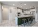 Well-lit kitchen with a large island, white cabinets, and modern appliances at 523 S 201St Ave, Buckeye, AZ 85326