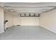 Spacious garage with epoxy flooring and installed shelving for storage at 5541 E Stella Ln, Paradise Valley, AZ 85253