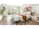 Bright main bedroom with mountain views, a private balcony, and two chairs with gray and white rug at 5541 E Stella Ln, Paradise Valley, AZ 85253