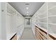 Well-organized walk-in closet with custom shelving, drawers, and ample storage space at 5541 E Stella Ln, Paradise Valley, AZ 85253