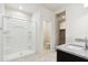 Bathroom featuring granite countertops, walk-in shower, and modern fixtures at 5584 E Rock Bush Ln, San Tan Valley, AZ 85140