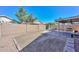 Spacious backyard with a gravel area, covered patio, and brick perimeter at 5726 W Mercury Way, Chandler, AZ 85226