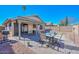 Inviting backyard with covered patio, brick pavers, and comfortable seating at 5726 W Mercury Way, Chandler, AZ 85226