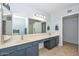 Bright bathroom features dual sinks, sleek counters, and a large mirror at 5726 W Mercury Way, Chandler, AZ 85226