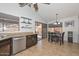 Bright kitchen featuring stainless steel appliances, wooden cabinets, and adjacent dining area at 5726 W Mercury Way, Chandler, AZ 85226