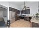 Well-lit kitchen featuring stainless steel appliances and dark wood cabinetry at 5726 W Mercury Way, Chandler, AZ 85226