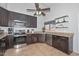 Functional kitchen with stainless steel appliances, granite countertops, and tile flooring at 5726 W Mercury Way, Chandler, AZ 85226