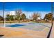 Well-maintained community basketball court with vibrant blue accents and surrounding green spaces at 6105 W Kimberly Way, Glendale, AZ 85308