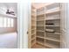 Bright walk-in closet with shelving at 6105 W Kimberly Way, Glendale, AZ 85308