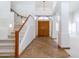 Bright entryway featuring tile floors, staircase, and soaring ceilings at 6105 W Kimberly Way, Glendale, AZ 85308