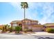 Charming two-story home with a desert landscape, palm tree, and tile roof at 6105 W Kimberly Way, Glendale, AZ 85308