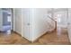 Hallway with travertine tile flooring, neutral paint, and staircase at 6105 W Kimberly Way, Glendale, AZ 85308