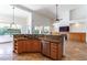 Modern kitchen featuring stainless steel appliances, granite countertops, and ample cabinet space at 6105 W Kimberly Way, Glendale, AZ 85308