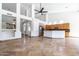 Open living space featuring tile floors, abundant natural light, and views of the kitchen at 6105 W Kimberly Way, Glendale, AZ 85308