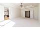 Bright main bedroom featuring plush carpet, recessed lighting, and an ensuite bathroom at 6105 W Kimberly Way, Glendale, AZ 85308