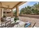 Spacious covered patio provides shade and a relaxed atmosphere in this gravel backyard at 6713 E Elmwood St, Mesa, AZ 85205