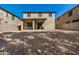 Expansive backyard with gravel landscaping and a covered patio, ideal for outdoor living at 6713 E Elmwood St, Mesa, AZ 85205