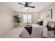 Relaxing bedroom featuring a tray with flowers and a ceiling fan at 6713 E Elmwood St, Mesa, AZ 85205