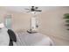 Spacious bedroom with a large bed, bedside tables, and an ensuite bathroom at 6713 E Elmwood St, Mesa, AZ 85205