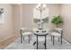 Bright dining room featuring modern table and chairs with natural lighting at 6713 E Elmwood St, Mesa, AZ 85205